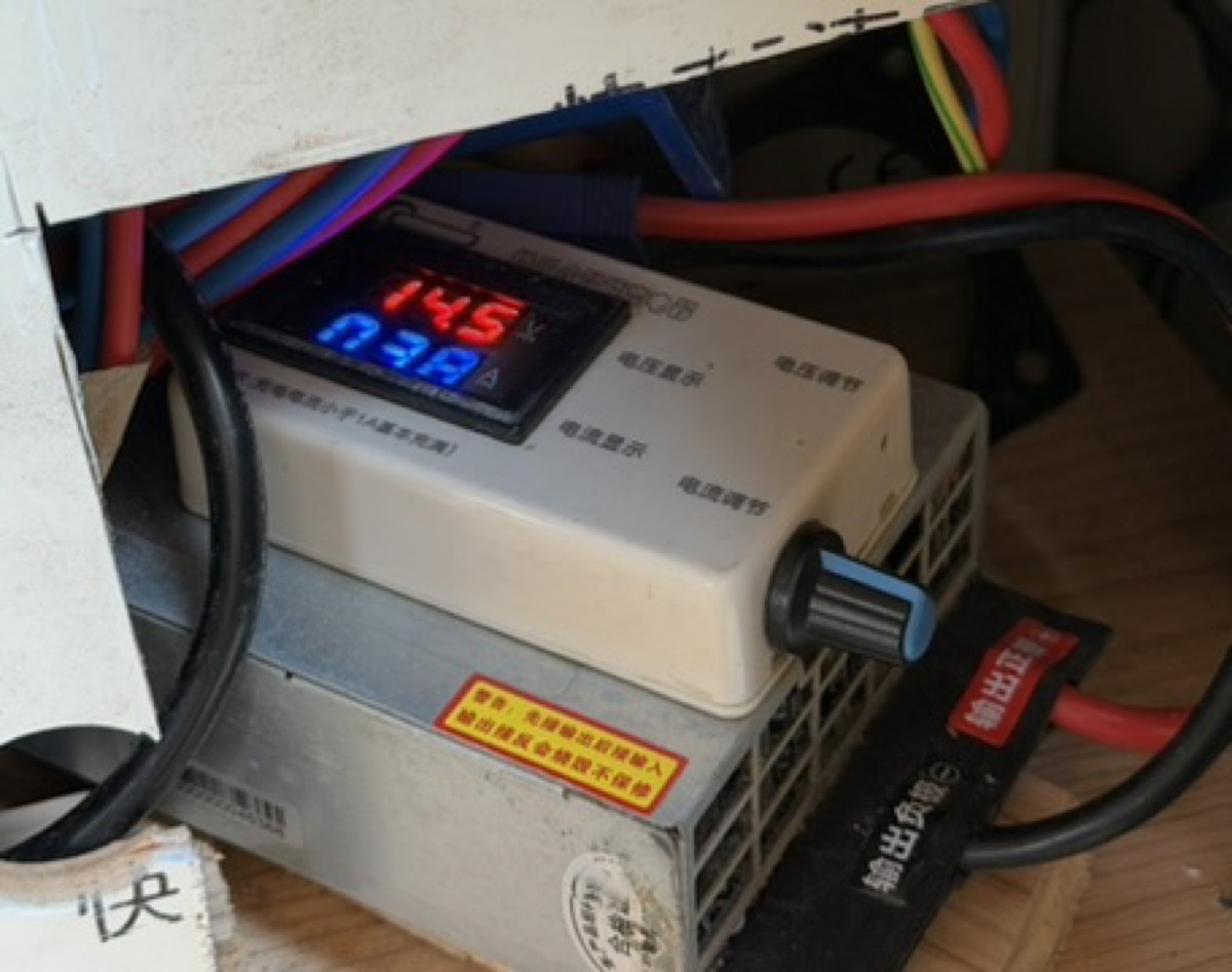 Taipei campervan charge speed knob behind coulomb meter door—blue knob controls rate; panel shows 14.5V and 0.38A live readings.
