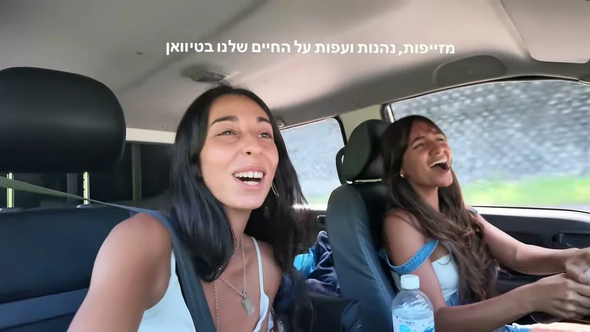 Two Israeli women singing happily during a nine-day Taiwan campervan road trip along the east coast, Green Island, Kenting and Sun Moon Lake